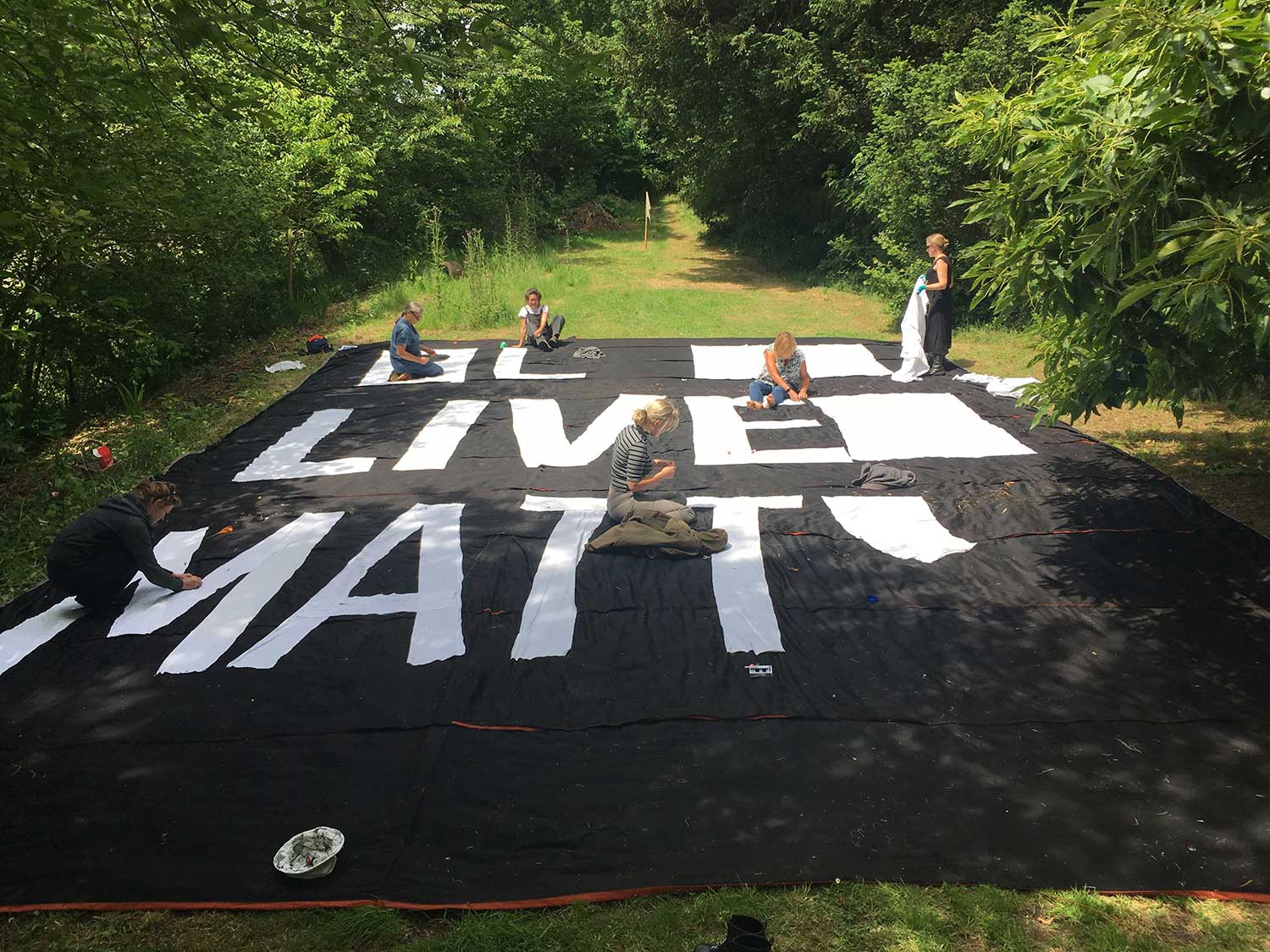Black Lives Matter Banner being painted